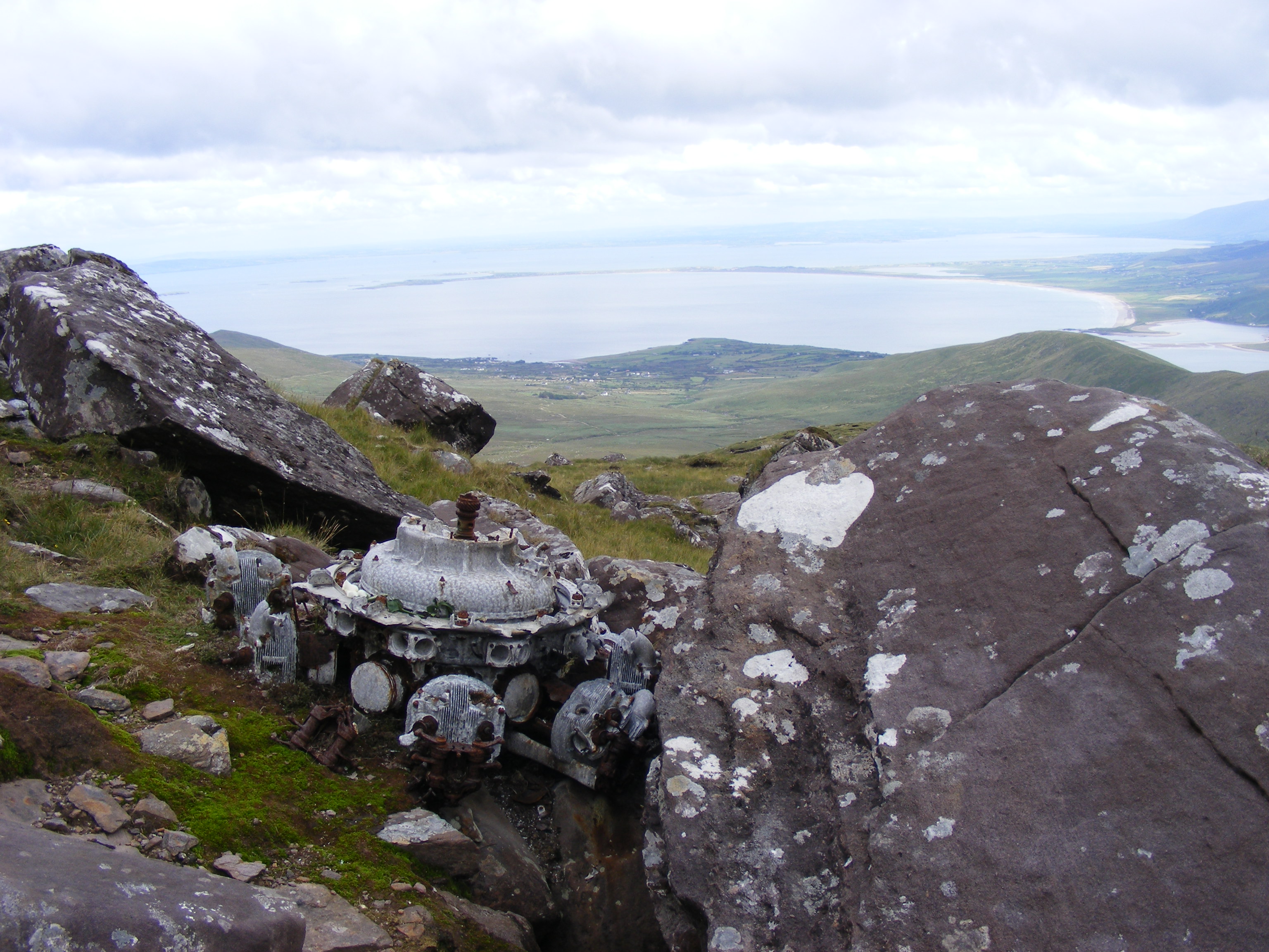 One of G-AGES engines sitting among the rocks,
              looking out over the slope she flew on her last flight.